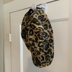 Distressed leopard print hat with high ponytail option